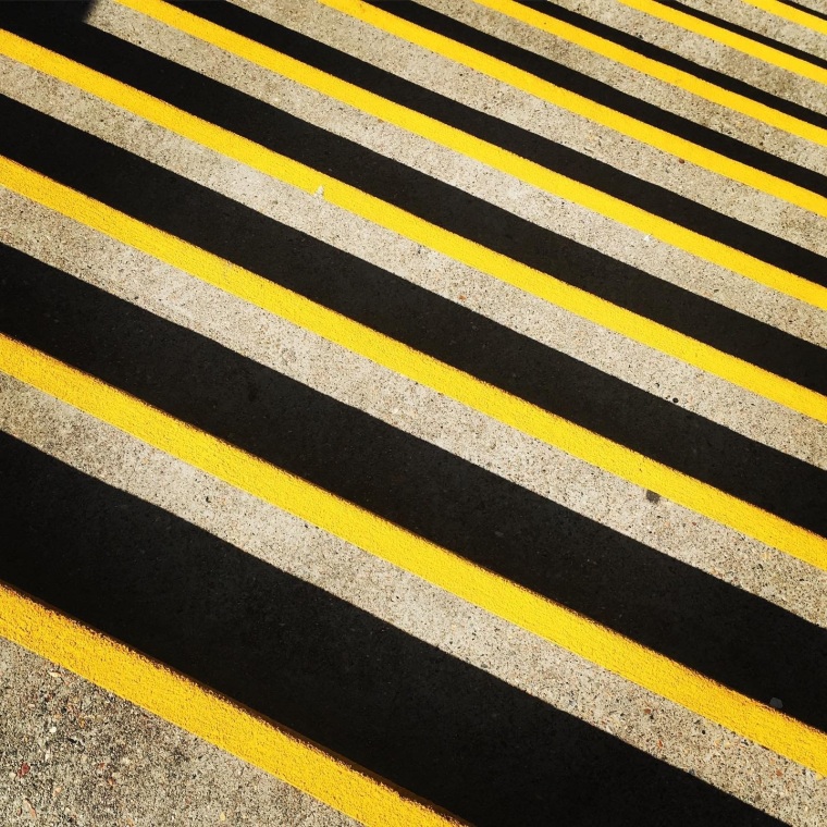 Stairs with black and yellow safety tape
